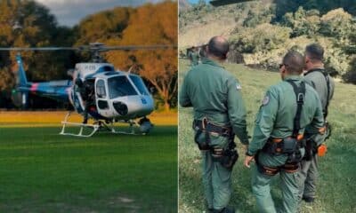 Helicóptero do Notaer e equipes de resgate atuam no salvamento de bombeiro ferido após queda de parapente em área de mata em Castelo